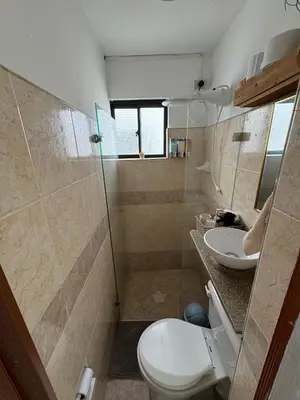 a bathroom with a toilet and a sink at Casa RAPA La70 in Medellín