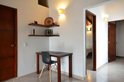 a dining room with a table and a chair at Vista Magnolia in Envigado