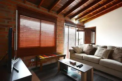 a living room with a couch and a table at Vista Magnolia in Envigado
