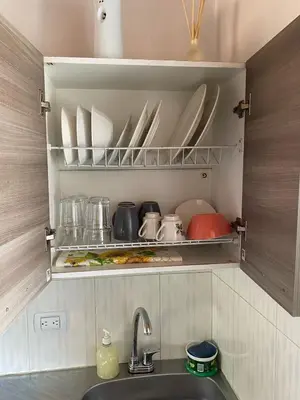 a kitchen with a sink and a shelf with dishes at Hermoso Aparta-Estudio En Envigado cerca de Medellin in Envigado