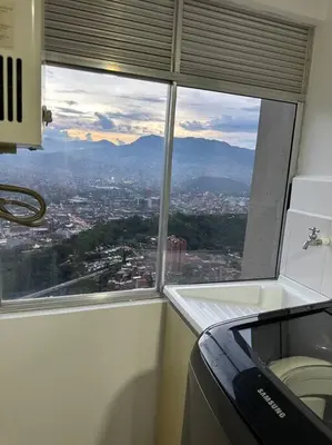 a window in an office with a view of a city at Medellín central in Medellín