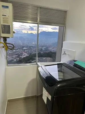 an office with a view of a window and a printer at Medellín central in Medellín
