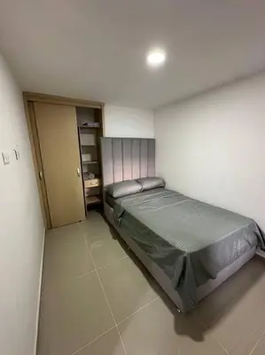 a bedroom with a large bed in a room at Medellín central in Medellín