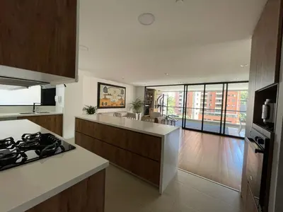 a kitchen with a stove and a counter top at Apartamento Montreal in Medellín