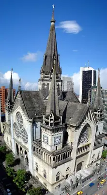 a large building with a clock tower on top of it at Habitación privada in Manizales