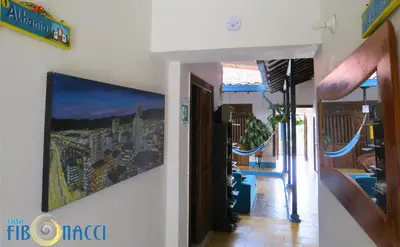 a living room with a painting on the wall at Casa Fibonacci in Titiribí
