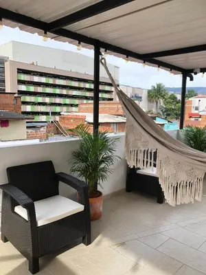 a hammock on the roof of a building at Aparta estudio 205- Casa Bendita in Medellín