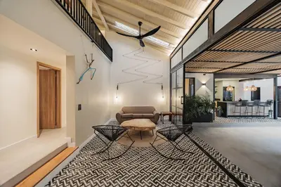 a living room with a couch and a table at 10A House Pool Provenza in Medellín