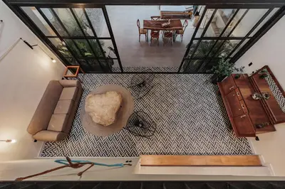 an overhead view of a living room with a couch and a table at 10A House Pool Provenza in Medellín