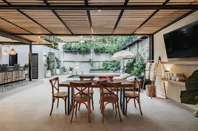 a dining room with a table and chairs at 10A House Pool Provenza in Medellín