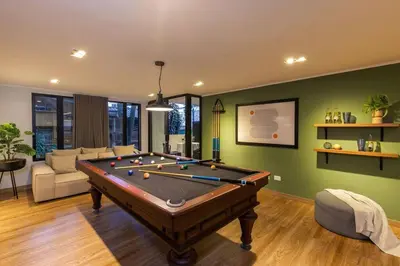 a living room with a pool table in it at Surprising, Lleras Park, Billar Pool And Jacuzzi in Medellín