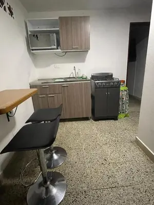 a small kitchen with a sink and a stove at El Descanso in Rionegro