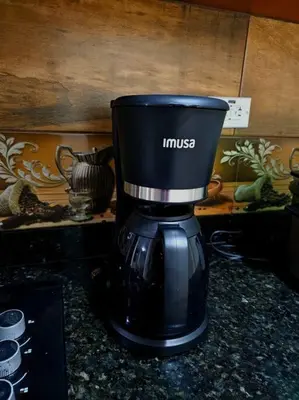 a coffee maker sitting on top of a counter at Espacioso y lindo lugar in Bello