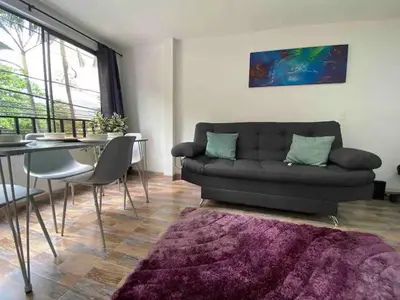 a living room with a couch and a table at Apartamento en Envigado al Sur de Medellin in Envigado