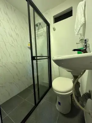 a bathroom with a sink and a toilet and a shower at Apartamento en Envigado al Sur de Medellin in Envigado