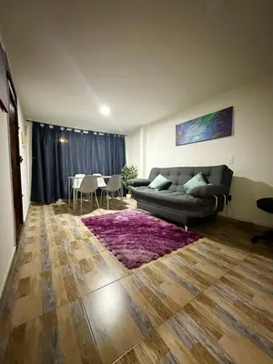 a living room with a couch and a table at Apartamento en Envigado al Sur de Medellin in Envigado