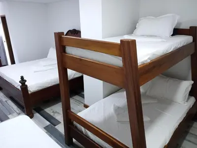 a couple of bunk beds in a room at Casa Finca Hotel Loma Encantada in Guatapé