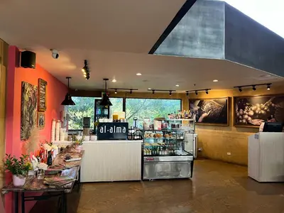 a restaurant with a counter in a room at Nmadas digitales - Hotel Rioverde in San Antonio de Pereira