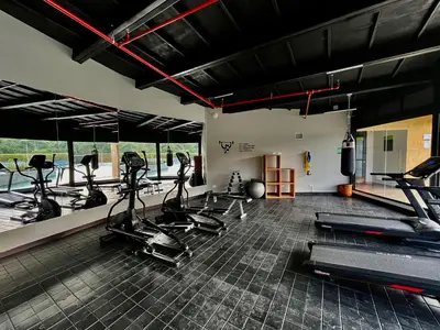 a gym with treadmills and elliptical machines at Nmadas digitales - Hotel Rioverde in San Antonio de Pereira