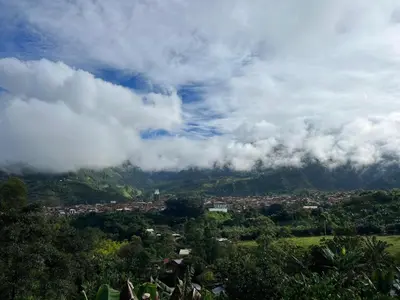 a view of a mountain with clouds in the sky at Hostal Artesanos in Jardin