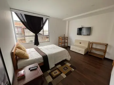 a bedroom with a bed and a window at ATHOS hotel boutique B&B in Pensilvania