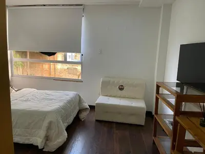 a bedroom with a bed and a window at ATHOS hotel boutique B&B in Pensilvania