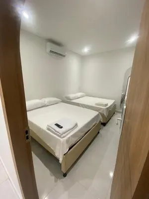 a room with two beds in a room at Habitaciones en Doradal 203 in Doradal
