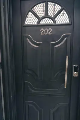 a black door with the number twentytwo on it at Aparta estudio 202 - Casa Bendita in Medellín