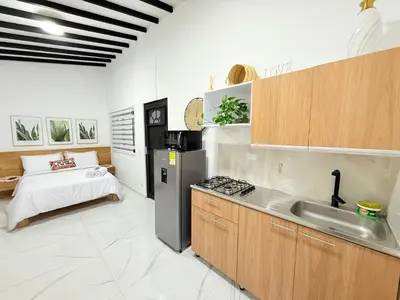 a kitchen with a sink and a bed in a room at Aparta estudio 202 - Casa Bendita in Medellín