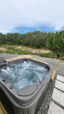 a hot tub sitting on the ground with a view at Villa Deluxe Curazao in El Peñol