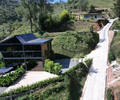 a house on a hill with a solarium at Villa Deluxe Curazao in El Peñol