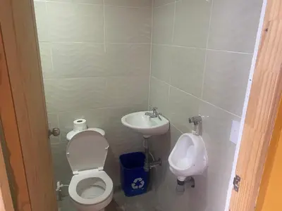 a bathroom with a toilet and a sink at Finca Villa Cristian Copacabana Antioquia in Copacabana