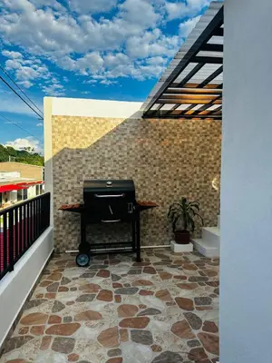 a balcony with a piano on a brick wall at CASA JAZZ Armonía y relax in Mariquita