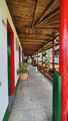 an empty hallway with potted plants on a building at Finca Carrizales in Jardin