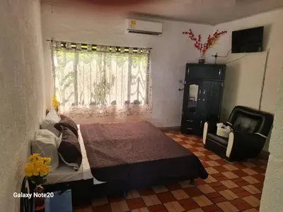 a bedroom with a bed and a window at Siboney hotel in Honda
