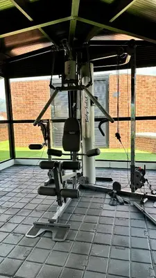 a room with a gym with a chair at Ubicación Privilegiada Laureles Medellin con Vista y AC in Medellín