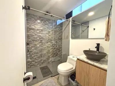 a bathroom with a sink and a toilet and a shower at c202 - Loft, hab1, baño 1, 1tv, sofacama, wifi in La Ceja