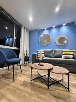 a living room with a couch and a table at 1905 Apto con estilo & moderno poblado in Medellín
