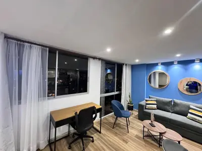 a living room with a couch and a table at 1905 Apto con estilo & moderno poblado in Medellín