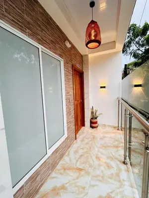 an empty lobby with a large window and a potted plant at Hotel Glorial in Doradal