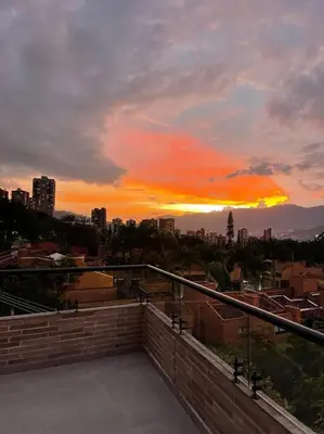 a view of a sunset from a balcony of a city at Apartamento 406 Poblado Cerca al CC El Tesoro in Medellín