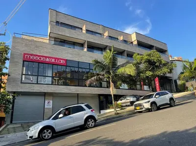 two silver cars parked in front of a building at Apartamento 406 Poblado Cerca al CC El Tesoro in Medellín