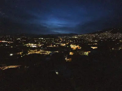 a view of a city at night at Vacacional, Casa ideal cerca a zona turística in Medellín