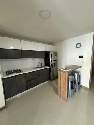 a kitchen with a refrigerator and a counter in it at Sector Tranquilo y Central, Excelente Vista in Manizales