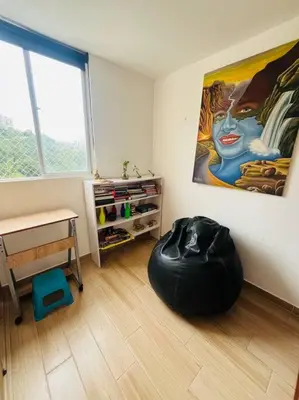 a room with a large painting on the wall at Apartamento Piscina sabaneta Medellín 20 minutos Poblado in Envigado