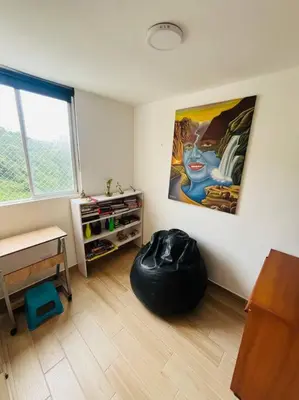 a room with a large painting on the wall at Apartamento Piscina sabaneta Medellín 20 minutos Poblado in Envigado