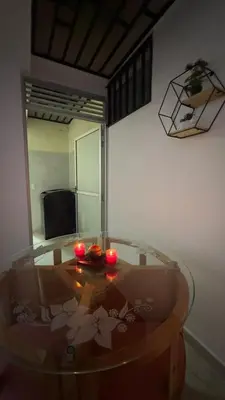 a room with a table with two candles on it at Diamante 204 in Guatapé