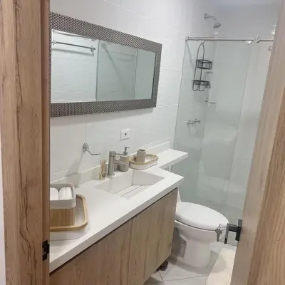 a bathroom with a sink and a toilet and a shower at Diamante 204 in Guatapé