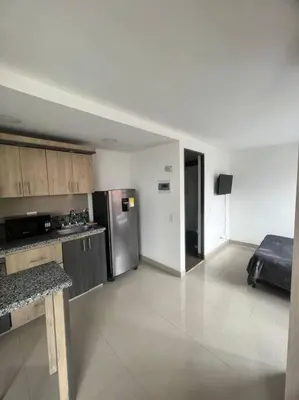 a kitchen with a stainless steel refrigerator in a room at Lindo apartamento poblado 111 in Medellín