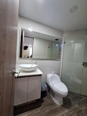 a bathroom with a sink and a toilet and a shower at Apartamento Laureles con Jacuzzi cerca al primer parque in Medellín
